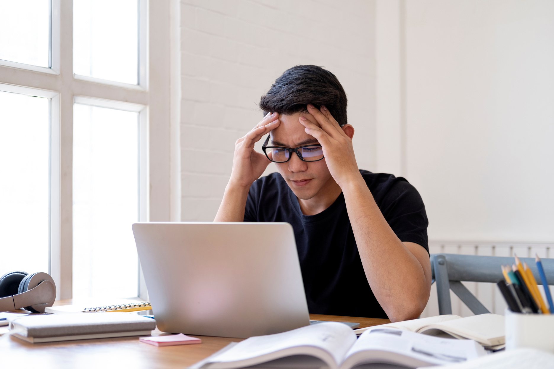 Doubt student working on homework or research work.